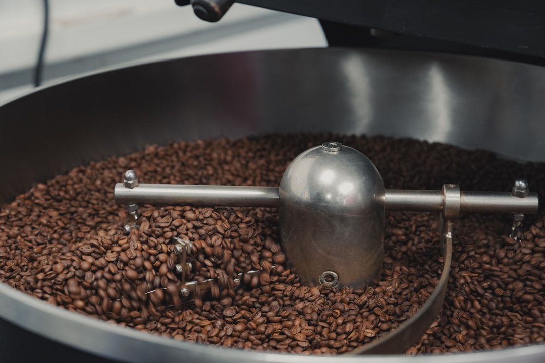 coffee-beans-being-roasted-in-a-large-industrial-machine-j1k252igcms